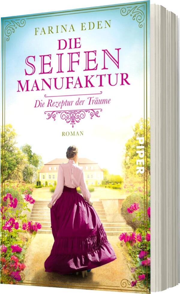 Das Buchcover zeigt eine romantische Szenerie mit einem strahlend blauen Himmel und sanften Wolken. Im Vordergrund sieht man eine Frau mit dunklen Haaren, die in einem langen, pinken Rock und einer weißen Bluse gekleidet ist. Sie steht in einem blühenden Garten, umgeben von grünen Bäumen und bunten Blumen. Der Titel „DIE SEIFEN MANUFAKTUR“ ist in kräftigem Pink oberhalb der Frau platziert, während darunter „Die Rezeptur der Träume“ und „Roman“ in eleganter Schrift stehen. Der Name der Autorin, Farina Eden, befindet sich am oberen Rand.