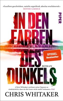 In den Farben des Dunkels Das Buchcover zeigt den Titel „IN DEN FARBEN DES DUNKELS“ in großen, auffälligen Buchstaben, die überwiegend in einem Farbverlauf von Schwarz zu lebhaftem Lila, Rot und Orange gestaltet sind. Der Hintergrund zeigt eine impressionistische Darstellung von Bäumen und Wasser mit sanften Übergängen in Pastellfarben. Oben rechts befindet sich ein orangefarbener Aufkleber mit dem Text „SPIEGEL Bestseller“. Darunter ist der Name des Autors, Chris Whitaker, in schwarzer Schrift platziert. Die Gesamtatmosphäre wirkt geheimnisvoll und ansprechend.