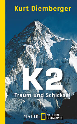 K2 - Traum und Schicksal Das Buchcover zeigt eine beeindruckende Berglandschaft mit dem K2 im Vordergrund, dessen schneebedeckte Gipfel kraftvoll und majestätisch wirken. Der Hintergrund ist in kühlen Blautönen gehalten, die die Erhabenheit des Berges unterstreichen. Im oberen Bereich steht der Name des Autors „Kurt Diemberger“ in weißer Schrift. Zentral ist der Titel „K2“ in großen, weißen Buchstaben, darunter steht der Untertitel „Traum und Schicksal“ in kleinerer Schrift. Der Buchrücken ist in einem kräftigen Gelb gestaltet, was einen starken Kontrast zur Bildkomposition bildet.