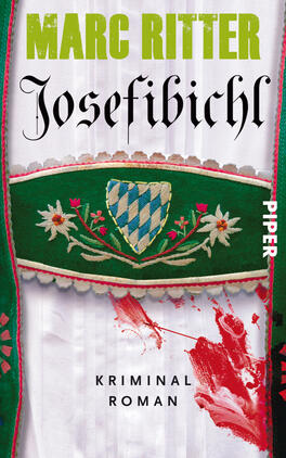Josefibichl Das Buchcover zeigt einen farbenfrohen Hintergrund mit einem zarten weißen Stoff, auf dem ein grünes, mit Blumen und einem bayerischen Wappen verziertes Band verläuft. Der Titel „Josefibichl“ steht in elegant geschwungener Schrift in Schwarz, während der Autorennamen „Marc Ritter“ in kräftigem Grün darüber prangt. Unter dem Titel befindet sich der Zusatz „Kriminal Roman“ in schlichterer Schrift. Ein blutroter Farbspritzer am unteren Rand vermittelt eine spannungsgeladene Atmosphäre.