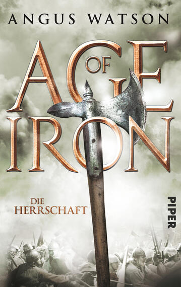 Das Buchcover zeigt den Titel „AGE OF IRON“ in großen, goldenen Buchstaben, die vor einem nebligen, grünlich-grauen Hintergrund erstrahlen. Unter dem Haupttitel steht in kleinerer, klarer Schrift „DIE HERRSCHAFT“. In der Mitte ist eine große, beeindruckende Axt abgebildet, die aufrecht steht und den Blick auf sich zieht. Im Hintergrund sind schemenhafte Figuren in Rüstungen zu erkennen, was eine kämpferische Stimmung vermittelt. Der Autorname „ANGUS WATSON“ ist oberhalb des Titels in schwarzer Schrift platziert.