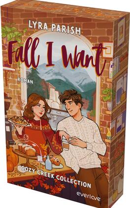 Fall I Want Das Buchcover zeigt eine warm-orangene, herbstliche Illustration in einem Ziegelbogen mit Blick auf schneebedeckte Berge. Vor dem Fenster sitzen zwei junge Erwachsene — Frau im roten Strickpullover mit Gebäck, Mann im cremefarbenen Pullover mit Tasse — an einem Tisch mit Kuchen, Kerzen und Kürbis. Oben steht „LYRA PARISH“ in weißen Versalien, der Titel „Fall I Want“ in großer burgunderroter, fließender Schrift; unten klein „Cozy Creek Collection“ und „Roman“.
