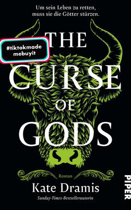 The Curse of Gods Das Buchcover zeigt einen schwarzen Hintergrund, vor dem ein stilisierter, grüner Wolfskopf prominent in der Mitte platziert ist. Der Titel „THE CURSE OF GODS“ erscheint in großem, weißem Schriftzug, während der Untertitel „Roman“ in kleineren Buchstaben darunter steht. Der Autorinnenname „Kate Dramis“ ist ebenfalls in Weiß und auffällig platziert. In der oberen linken Ecke befindet sich ein weißer Kreis mit dem Text „Vorläufiges Cover“. Ein mehrfarbiger, rechteckiger Button mit dem Hashtag „#tiktokmade mebuyit“ ist am unteren Rand des Covers angebracht. Die Atmosphäre ist mystisch und düster.