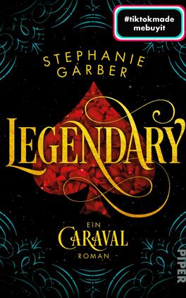 Legendary Das Buchcover zeigt einen dunklen, nahezu schwarzen Hintergrund, der die Wirkung der hellen Designelemente verstärkt. Im Zentrum befindet sich ein rotes, stilisiertes Herz, umgeben von geschwungenen goldenen Linien. Der Titel „LEGENDARY“ ist in großen, eleganten, goldenen Buchstaben gestaltet, während der Name der Autorin „Stephanie Garber“ in einer schmaleren Schrift oberhalb des Titels platziert ist. Unten steht der Zusatz „ein Caraval Roman“. In der oberen rechten Ecke befindet sich ein Button in Rottönen mit dem Text „#tiktokmade mebuyit“.