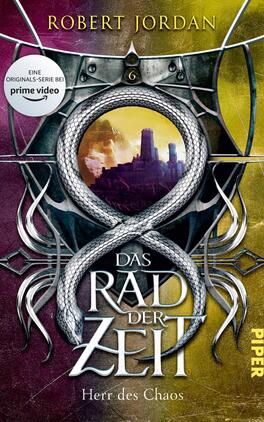 Das Rad der Zeit 6 Das Buchcover zeigt eine dramatische Farbkombination aus Lila und Gelb. Im Zentrum ist ein großes, geschwungenes Symbol, das an eine unendliche Schlange erinnert, umgeben von einem filigranen, metallischen Rahmen. Der Titel „DAS RAD DER ZEIT“ ist in auffälliger, weißer Schrift prominent platziert, während der Untertitel „Herr des Chaos“ in kleinerer Schrift darunter steht. Oben links befindet sich ein Hinweis auf die Original-Serie bei Prime Video.