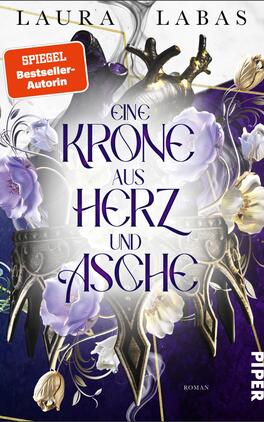 Eine Krone aus Herz und Asche Das Buchcover zeigt eine stilisierte Krone, die aus imposanten, dunklen Materialien gefertigt zu sein scheint, umgeben von zarten lila Blumen. Der Titel „EINE KRONE AUS HERZ UND ASCHE“ ist in großen, eleganten Lettern zentral platziert, wobei das Wort „HERZ“ hervorgehoben ist. Oben auf dem Cover steht der Name der Autorin, Laura Labas, und ein rotes Kästchen mit der Aufschrift „SPIEGEL-Bestseller-Autorin“. Der gesamte Hintergrund ist in tiefen, mystischen Farbtönen gehalten, die eine düstere, aber auch fesselnde Atmosphäre erzeugen.